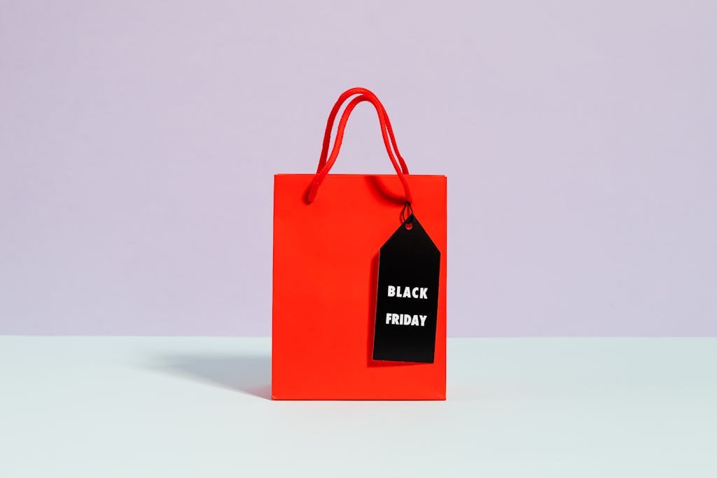 Vibrant red shopping bag with a Black Friday tag, perfect for sale promotions.